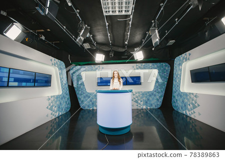 Young pretty tv presenter in studio before broadcasting 78389863
