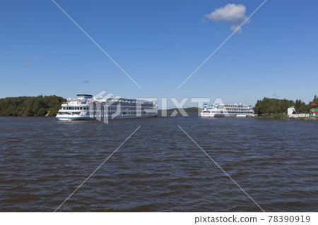 Cruise ship Maxim Litvinov goes according Sheksna river near the harbor in the village of Goritsy, Kirillov district Vologda region Cruise ship Maxim Litvinov goes according Sheksna river near the harbor in the village of Goritsy, Kirillov district Vologda region 78390919