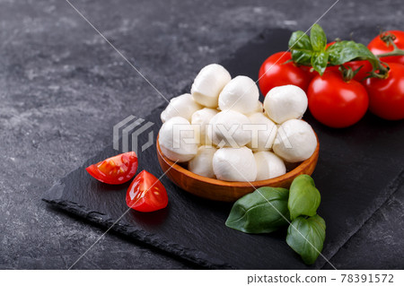 Mozzarella cheese, basil and tomato cherry Mozzarella cheese, basil and tomato cherry 78391572