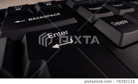 Enter button with letters and arrow sign on black keyboard Enter button with letters and arrow sign on black keyboard 78392118