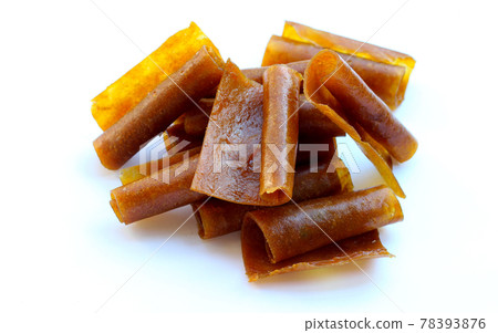 Dried mango paste on white background. Dried mango paste on white background. 78393876
