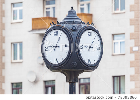 Retro style clock on the column on the street. Retro style clock on the column on the street. 78395866