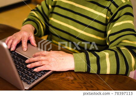 Senior woman using a computer Senior woman using a computer 78397113