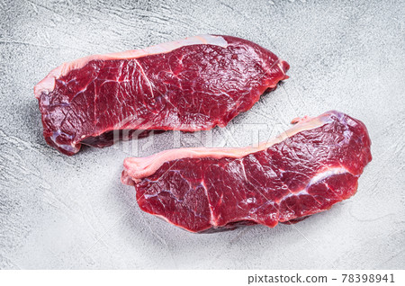 Fresh Raw sirloin beef meat steak. white background. Top view 78398941