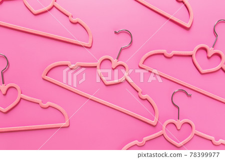Black Friday or clothing industry concept on pink background with hangers Black Friday or clothing industry concept on pink background with hangers 78399977