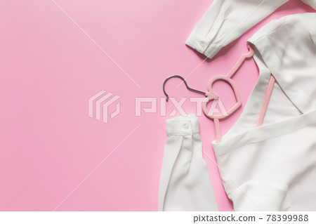 Black Friday or clothing industry concept, pink background, hanger, white blouse Black Friday or clothing industry concept, pink background, hanger, white blouse 78399988