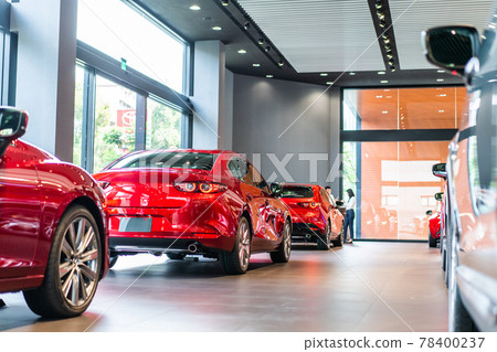 blur view of new modern car in showroom 78400237