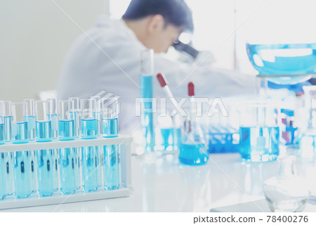 Male Scientist look into Microscope research in science laboratory. Asian scientist looking equipment laboratory chemistry labs. Covid-19 coronavirus biochemistry research experiment vaccine concept 78400276