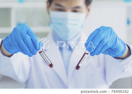 Scientist covid-19 virus chemistry  research experiment biotech antibody sample laboratory cultivate vaccine against virus. Scientist look at microscope, science test tube analyse Chemistry laboratory 78400282