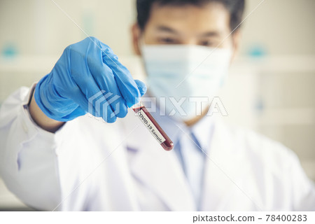 Scientist covid-19 virus chemistry  research experiment biotech antibody sample laboratory cultivate vaccine against virus. Scientist look at microscope, science test tube analyse Chemistry laboratory 78400283