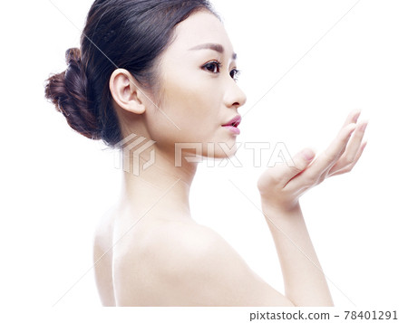 studio portrait of a young asian woman, side view, isolated on white 78401291
