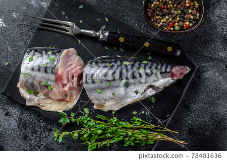 Cold smoked mackerel fish with herbs. Black background. Top view 78401636