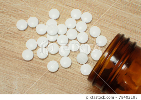 Tablets taken out of the medicine bottle Tablets taken out of the medicine bottle 78402195