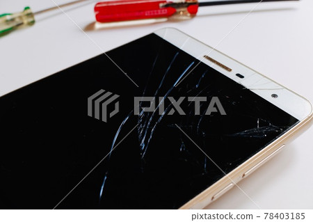 Smartphone with a cracked screen 78403185