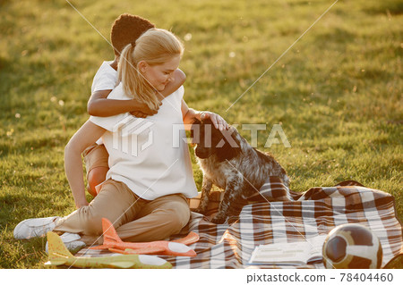 Multi-racial family playing in a summer park Multi-racial family playing in a summer park 78404460