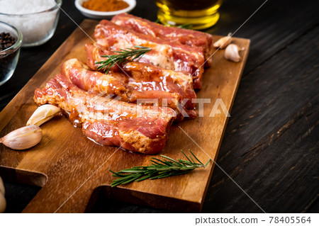 Fresh raw pork ribs ready for roasting with ingredients Fresh raw pork ribs ready for roasting with ingredients 78405564
