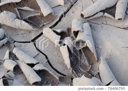Flakes of dried mud as a background. Dry barren soil texture. 78406795