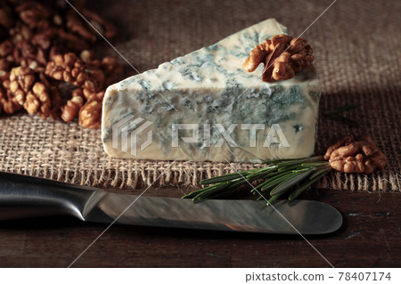 Blue cheese with walnuts and rosemary. Blue cheese with walnuts and rosemary. 78407174