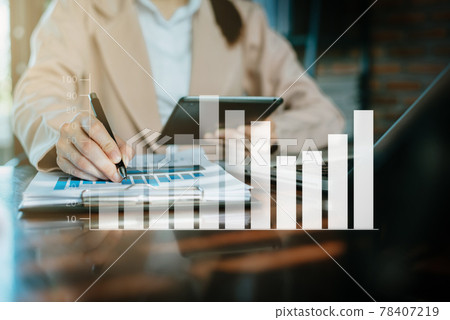Business women hand working with tablet and laptop computer with documents on office desk with virtual interface graphic icons network diagram in modern office. Business women hand working with tablet and laptop computer with documents on office desk with virtual interface graphic icons network diagram in modern office. 78407219