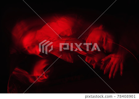 portrait of a psychotic woman with mental disorders and bipolar disease in a white straitjacket portrait of a psychotic woman with mental disorders and bipolar disease in a white straitjacket 78408901