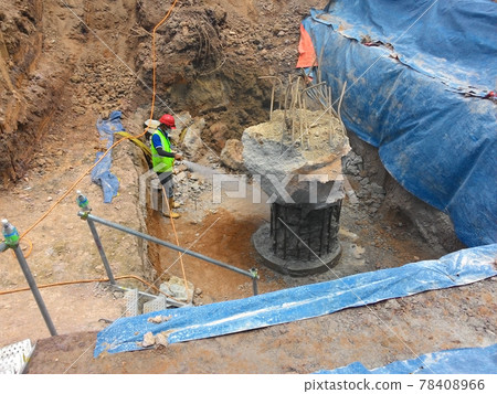 SELANGOR, MALAYSIA - JANUARY 15, 2017: Foundation work include the building piling works and pile cap construction at the construction site. Heavy construction work with full awareness about workers s SELANGOR, MALAYSIA - JANUARY 15, 2017: Foundation work include the building piling works and pile cap construction at the construction site. Heavy construction work with full awareness about workers s 78408966