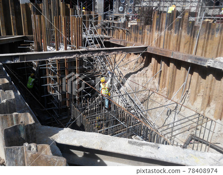 SELANGOR, MALAYSIA - JANUARY 15, 2017: Foundation work include the building piling works and pile cap construction at the construction site. Heavy construction work with full awareness about workers s SELANGOR, MALAYSIA - JANUARY 15, 2017: Foundation work include the building piling works and pile cap construction at the construction site. Heavy construction work with full awareness about workers s 78408974