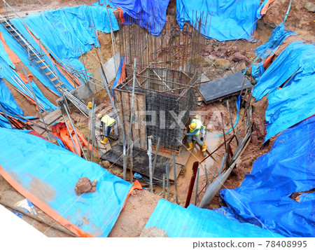 SELANGOR, MALAYSIA - JANUARY 15, 2017: Foundation work include the building piling works and pile cap construction at the construction site. Heavy construction work with full awareness about workers s 78408995