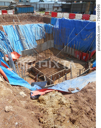 SELANGOR, MALAYSIA - JANUARY 15, 2017: Foundation work include the building piling works and pile cap construction at the construction site. Heavy construction work with full awareness about workers s SELANGOR, MALAYSIA - JANUARY 15, 2017: Foundation work include the building piling works and pile cap construction at the construction site. Heavy construction work with full awareness about workers s 78408996