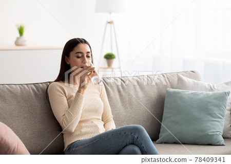 Woman enjoy good habit drink mineral aqua at morning take care of skin, body, health and beauty 78409341