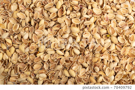 Pile of pistachios husks isolated on white background Pile of pistachios husks isolated on white background 78409792