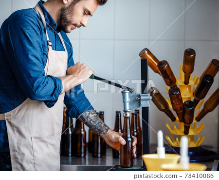 Small business, startup and brewery work. Craft drink production at modern plant Small business, startup and brewery work. Craft drink production at modern plant 78410086