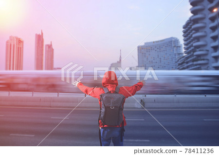 Back view of a young asian man with traveling backpacker in city road outdoor in Bangkok, Thailand. The concept of travel is discovering new places. Back view of a young asian man with traveling backpacker in city road outdoor in Bangkok, Thailand. The concept of travel is discovering new places. 78411236