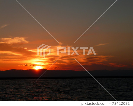Sea stained at sunset Sea stained at sunset 78412021