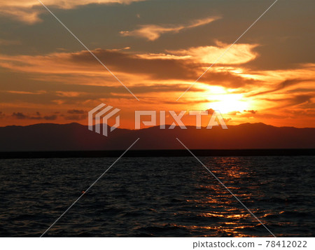 Sea stained at sunset 78412022