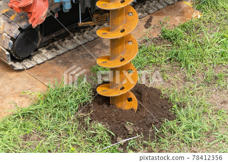 Construction site foundation work auger screw advance excavation 78412356