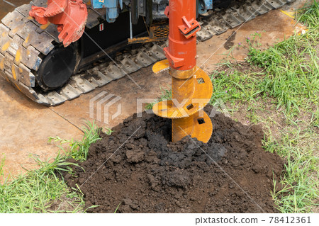 Construction site foundation work auger screw advance excavation 78412361