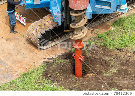Construction site foundation work, auger screw advance excavation, second 78412369