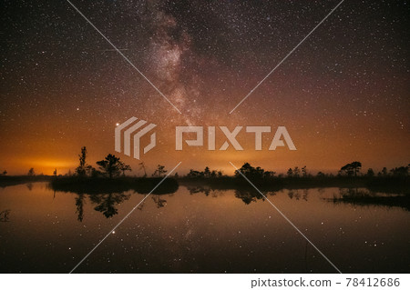 Swamp Bog Marsh Wetland Lake Nature Night Landscape. Night Starry Sky Milky Way Galaxy With Glowing Stars And Moon. Nature Night Sky Reflection In Water. Yelnya Swamp In Belarus Swamp Bog Marsh Wetland Lake Nature Night Landscape. Night Starry Sky Milky Way Galaxy With Glowing Stars And Moon. Nature Night Sky Reflection In Water. Yelnya Swamp In Belarus 78412686