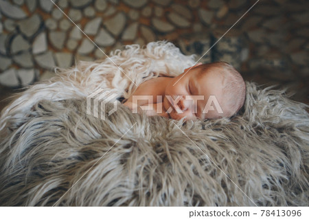 Portrait of newborn baby on a white background. Portrait of newborn baby on a white background. 78413096