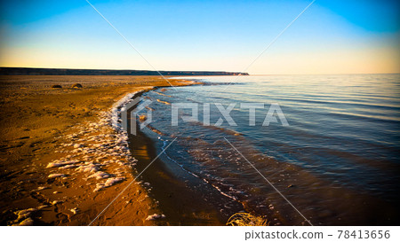 Sea foam at the beach of the Aral Sea near Aktumsuk cape at sunset, Karakalpakstan, Uzbekistan Sea foam at the beach of the Aral Sea near Aktumsuk cape at sunset, Karakalpakstan, Uzbekistan 78413656