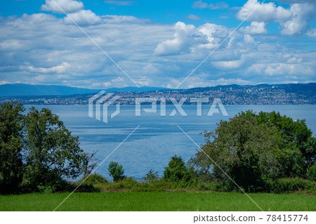 View from the French shore of Lac Leman towards the opposite Swiss coast View from the French shore of Lac Leman towards the opposite Swiss coast 78415774