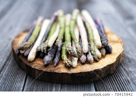 Green, purple and white asparagus sprouts Green, purple and white asparagus sprouts 78415942