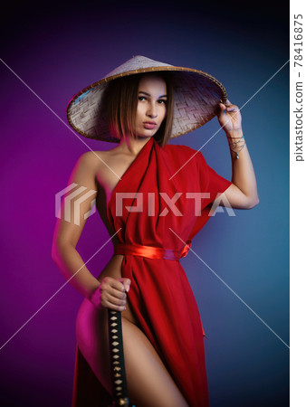 sexy woman in a red cape and an Asian hat with a katana in her hand image of a samurai in neon color sexy woman in a red cape and an Asian hat with a katana in her hand image of a samurai in neon color 78416875