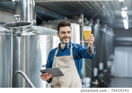 Quality control of alcoholic beverage in production and work in brewery inspecting quality of production at factory Quality control of alcoholic beverage in production and work in brewery inspecting quality of production at factory 78419143