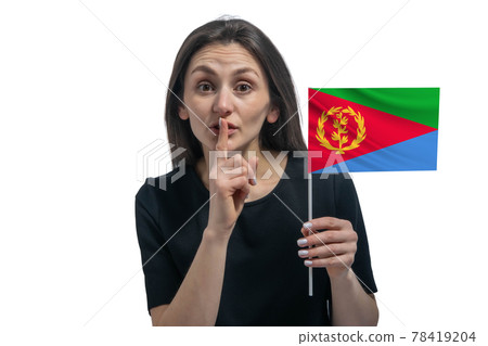 Happy young white woman holding flag of Eritrea and holds a finger to her lips isolated on a white background Happy young white woman holding flag of Eritrea and holds a finger to her lips isolated on a white background 78419204