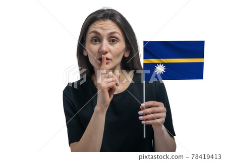 Happy young white woman holding flag of Nauru and holds a finger to her lips isolated on a white background 78419413
