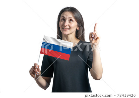 Happy young white woman holding flag of Russia and points thumbs up isolated on a white background 78419426