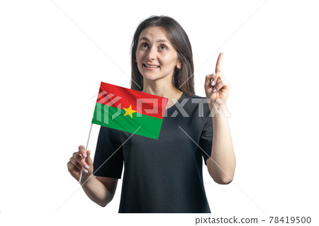 Happy young white woman holding flag of Burkina Faso and points thumbs up isolated on a white background Happy young white woman holding flag of Burkina Faso and points thumbs up isolated on a white background 78419500