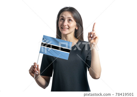 Happy young white woman holding flag of Botswana and points thumbs up isolated on a white background 78419501