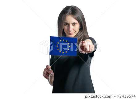 Happy young white woman holding flag of European Union and points forward in front of him isolated on a white background Happy young white woman holding flag of European Union and points forward in front of him isolated on a white background 78419574